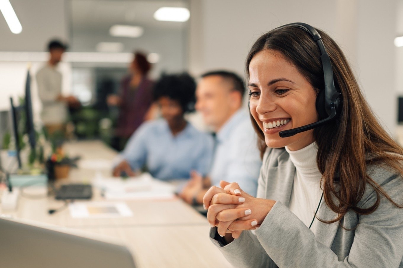 woman reception working in office iStock-1958337065 3x2